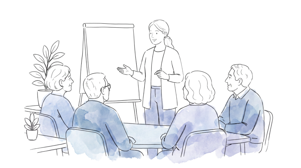 Gruppe vor einer Moderatorin im Gedächtnistraining